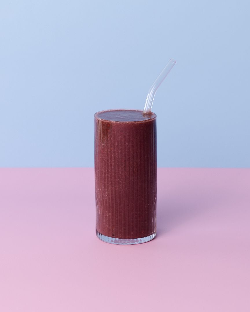 Glass with Acai Activate smoothie ingredients blended together 