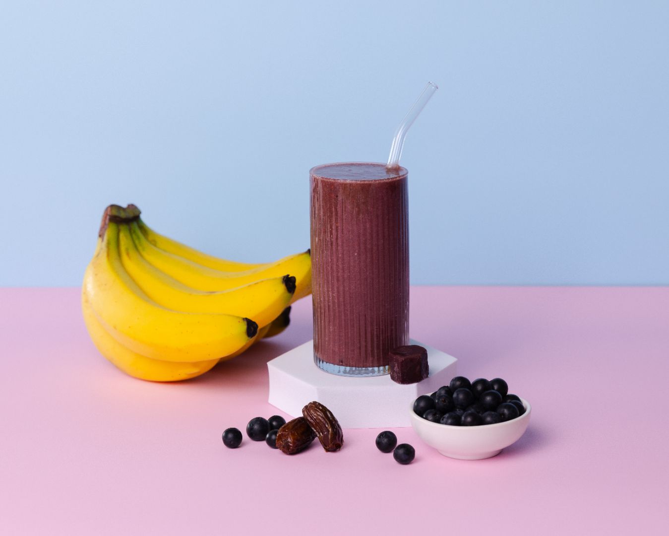 Healthy smoothie made with Acai Activate ready-to-blend pack with ingredients on the table