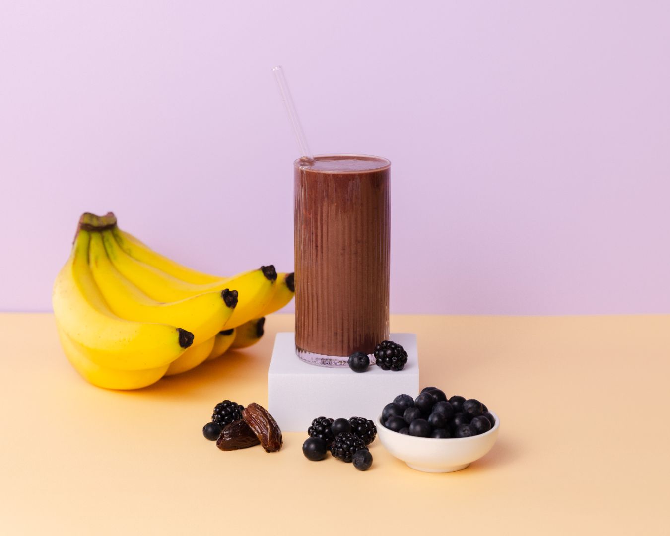 Healthy smoothie made with Detox ready-to-blend pack and ingredients on table